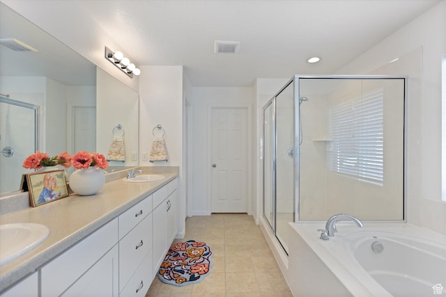 full bath featuring a shower stall, a garden tub, double vanity, recessed lighting, and tile patterned flooring