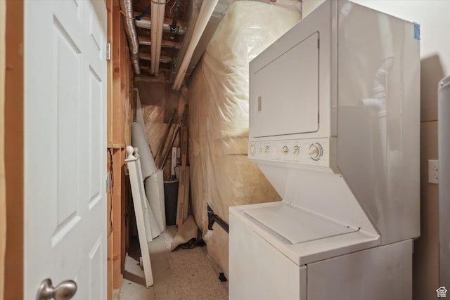 laundry room with stacked washer and clothes dryer