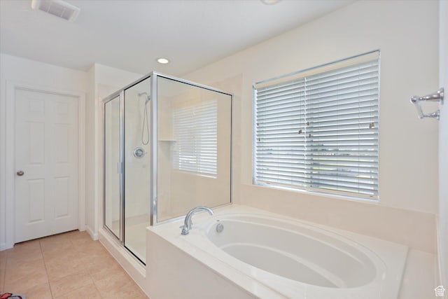 bathroom with a stall shower, a garden tub, tile patterned floors, and recessed lighting