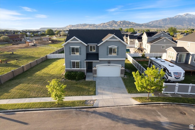 traditional home featuring driveway, a mountain view, stucco siding, a garage, and a residential view