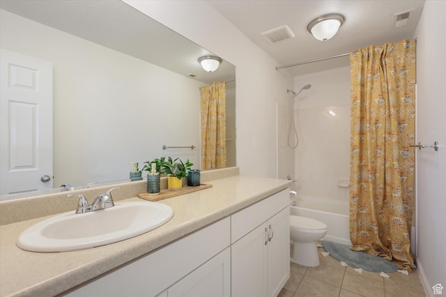 bathroom with tile patterned floors, shower / bath combination with curtain, toilet, and vanity
