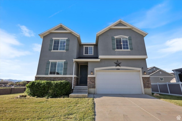 view of front of home with stone siding, stucco siding, a garage, and concrete driveway