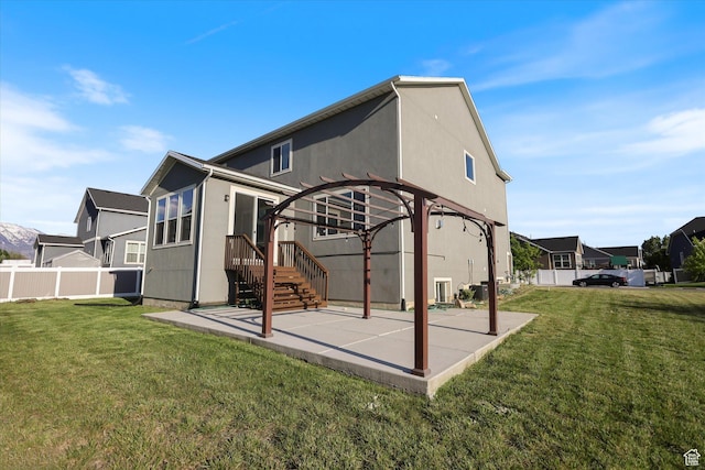 back of property featuring a pergola, a patio, and stucco siding