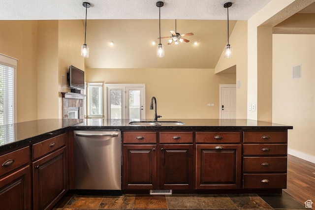kitchen with stainless steel dishwasher, a sink, ceiling fan, high vaulted ceiling, and a textured ceiling