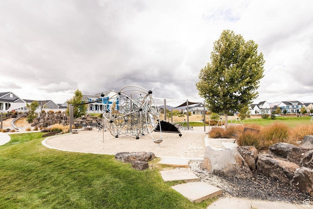 communal playground with a residential view and a lawn