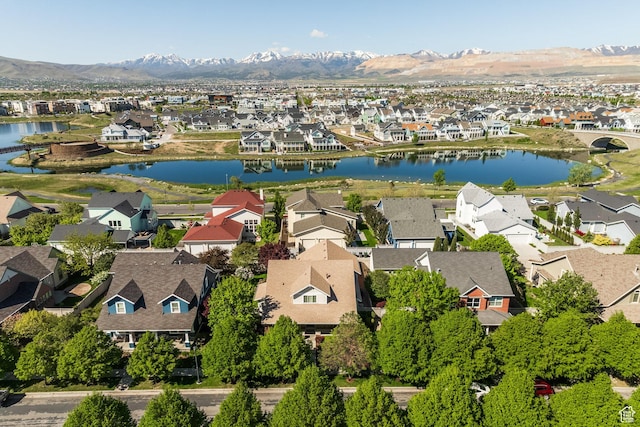 aerial perspective of suburban area featuring a water and mountain view