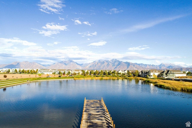 dock area featuring a water and mountain view