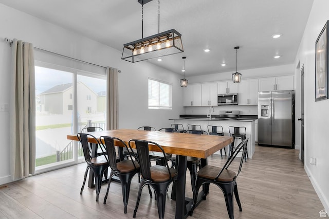 2607 N Mclaws Ave, Layton, UT 84040 - dining room with light wood-style floors, recessed lighting, and baseboards