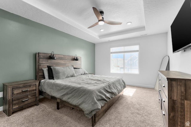 2607 N Mclaws Ave, Layton, UT 84040 - bedroom featuring light colored carpet, a tray ceiling, a ceiling fan, baseboards, and recessed lighting