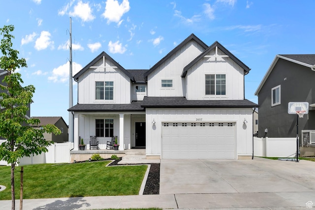 2607 N Mclaws Ave, Layton, UT 84040 - modern farmhouse style home with a porch, board and batten siding, a garage, and driveway
