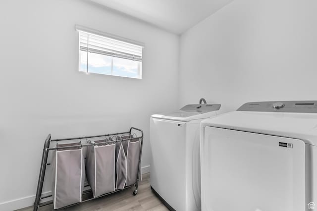 2607 N Mclaws Ave, Layton, UT 84040 - washroom featuring separate washer and dryer, light wood finished floors, and baseboards