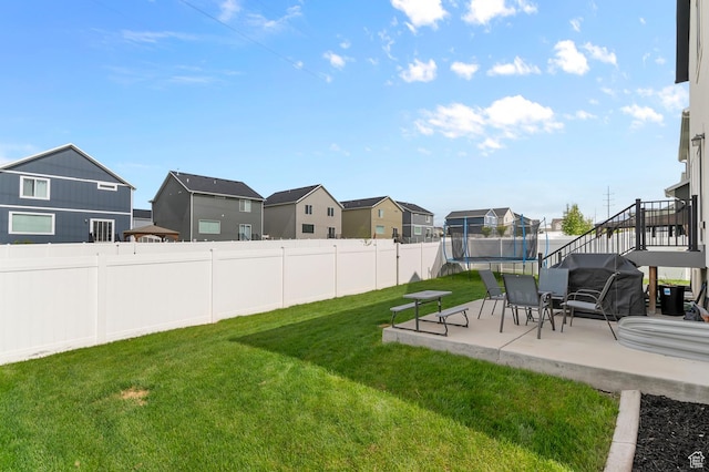 2607 N Mclaws Ave, Layton, UT 84040 - view of yard with a trampoline, a patio, and a residential view