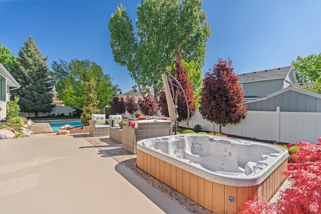 10543 S 2330 W, South Jordan, UT 84095 - view of patio / terrace with a hot tub and a fenced backyard