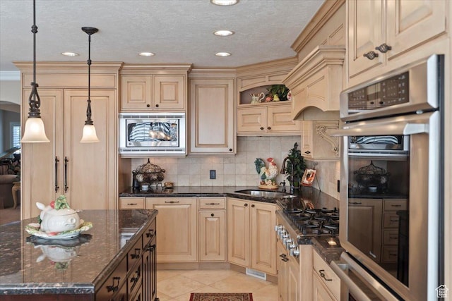 10543 S 2330 W, South Jordan, UT 84095 - kitchen featuring appliances with stainless steel finishes, a sink, backsplash, hanging light fixtures, and light tile patterned floors