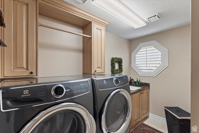 10543 S 2330 W, South Jordan, UT 84095 - washroom with washing machine and dryer, cabinet space, light tile patterned floors, a textured ceiling, and baseboards