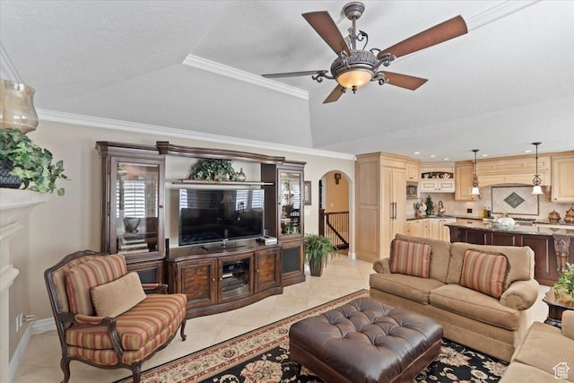10543 S 2330 W, South Jordan, UT 84095 - living area with light tile patterned floors, arched walkways, a tray ceiling, ceiling fan, and baseboards