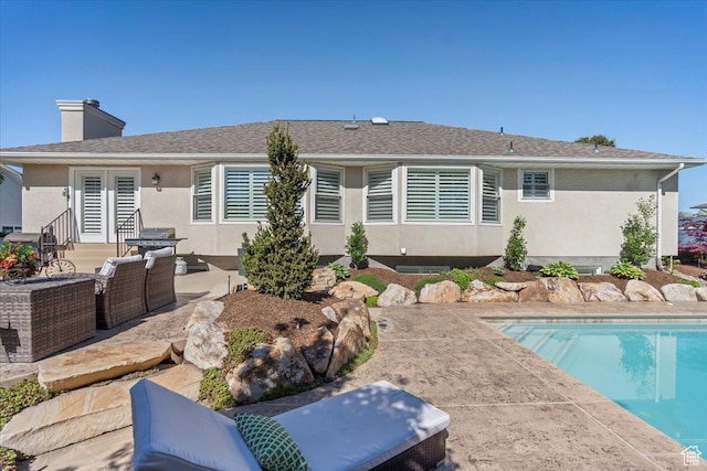 10543 S 2330 W, South Jordan, UT 84095 - back of house with a patio, an outdoor pool, and stucco siding