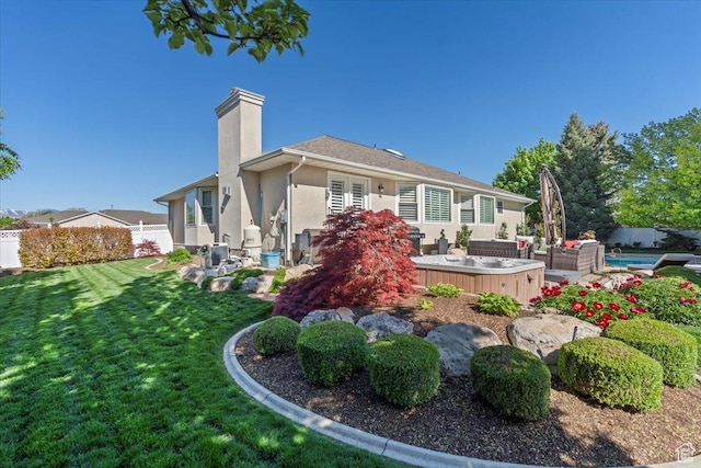10543 S 2330 W, South Jordan, UT 84095 - back of house featuring stucco siding, a chimney, and an outdoor hangout area