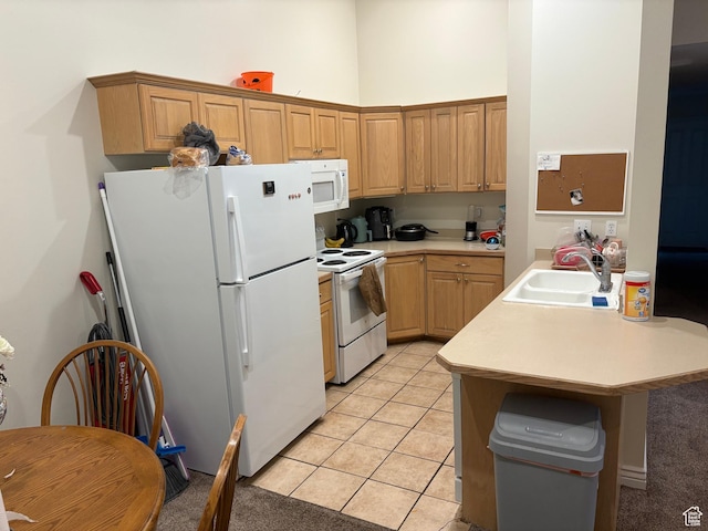 1559 N Riverside Ave Unit 9, Provo, UT 84604 - kitchen with white appliances, a sink, light countertops, light tile patterned flooring, and a peninsula