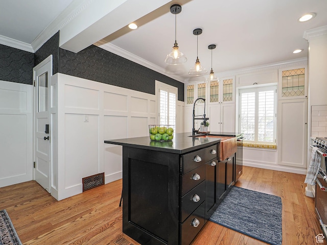 1133 S 1400 E, Salt Lake City, UT 84105 - kitchen with ornamental molding, a decorative wall, wallpapered walls, dark cabinetry, and dark countertops