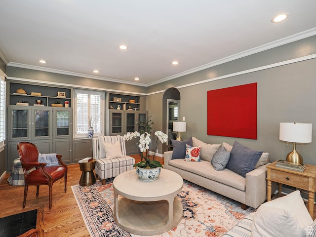 1133 S 1400 E, Salt Lake City, UT 84105 - living area with arched walkways, light wood-style floors, ornamental molding, recessed lighting, and baseboards