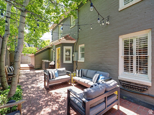 1133 S 1400 E, Salt Lake City, UT 84105 - view of patio with outdoor lounge area, central AC unit, and fence