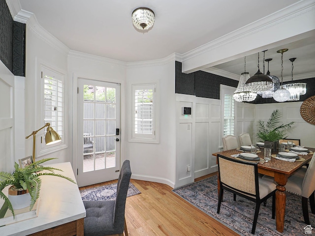 1133 S 1400 E, Salt Lake City, UT 84105 - dining room featuring light wood-type flooring, a chandelier, crown molding, and baseboards