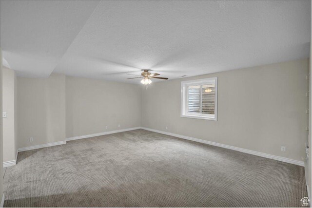 1659 S Cobblestone Ln, St George, UT 84790 - empty room featuring a ceiling fan, carpet floors, baseboards, and a textured ceiling