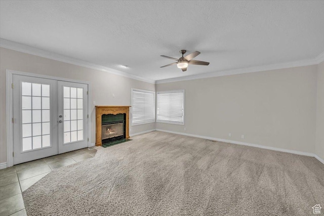 1659 S Cobblestone Ln, St George, UT 84790 - unfurnished living room featuring ceiling fan, french doors, crown molding, a textured ceiling, and baseboards