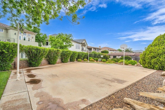 1659 S Cobblestone Ln, St George, UT 84790 - view of patio featuring a residential view and fence