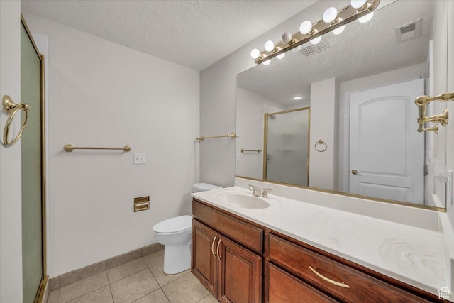 1659 S Cobblestone Ln, St George, UT 84790 - bathroom with a stall shower, tile patterned flooring, toilet, vanity, and a textured ceiling