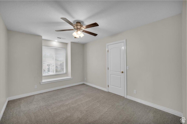1659 S Cobblestone Ln, St George, UT 84790 - spare room with carpet floors, baseboards, a ceiling fan, and a textured ceiling