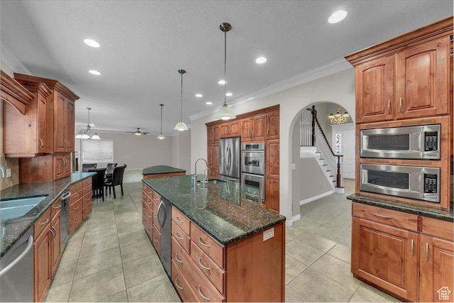 1659 S Cobblestone Ln, St George, UT 84790 - kitchen featuring appliances with stainless steel finishes, crown molding, ceiling fan, recessed lighting, and baseboards
