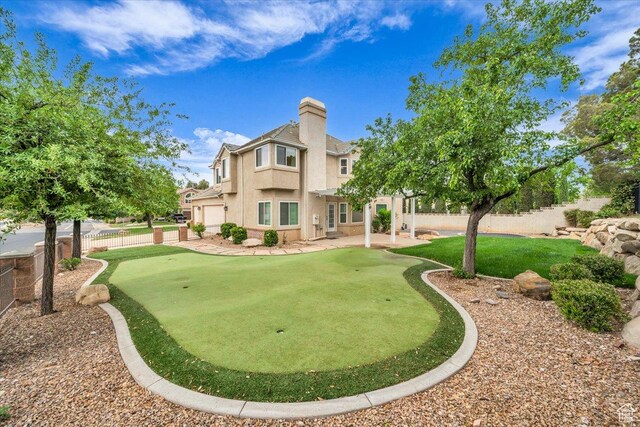 1659 S Cobblestone Ln, St George, UT 84790 - view of home's community featuring a putting area, a pergola, fence, a garage, and a patio area