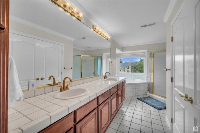 1659 S Cobblestone Ln, St George, UT 84790 - bathroom featuring a stall shower, double vanity, a bath, tile patterned floors, and ornamental molding