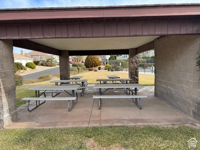 1659 S Cobblestone Ln, St George, UT 84790 - surrounding community featuring a patio area and a lawn