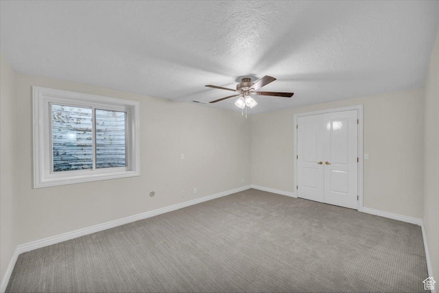 1659 S Cobblestone Ln, St George, UT 84790 - carpeted spare room with ceiling fan, baseboards, and a textured ceiling