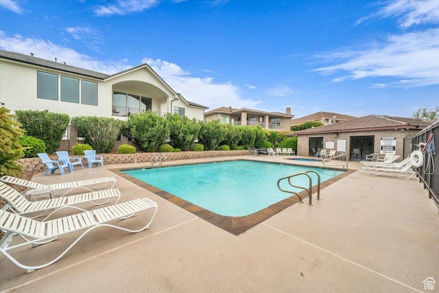 1659 S Cobblestone Ln, St George, UT 84790 - community pool with a patio area and a community hot tub