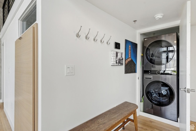 washroom featuring estacked washer and dryer and light wood finished floors