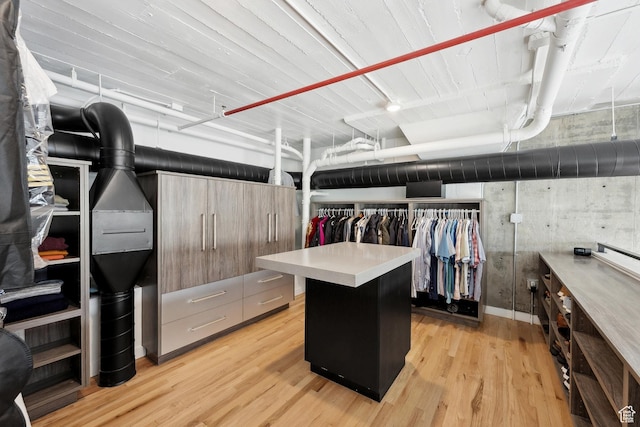 walk in closet featuring light wood-style floors