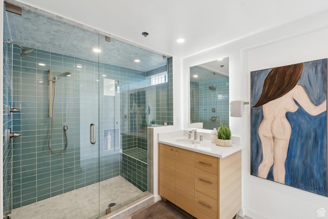 full bath featuring a stall shower and vanity