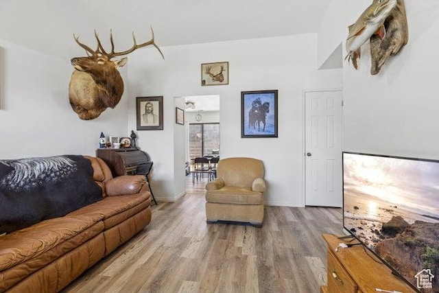 living room with wood finished floors and baseboards