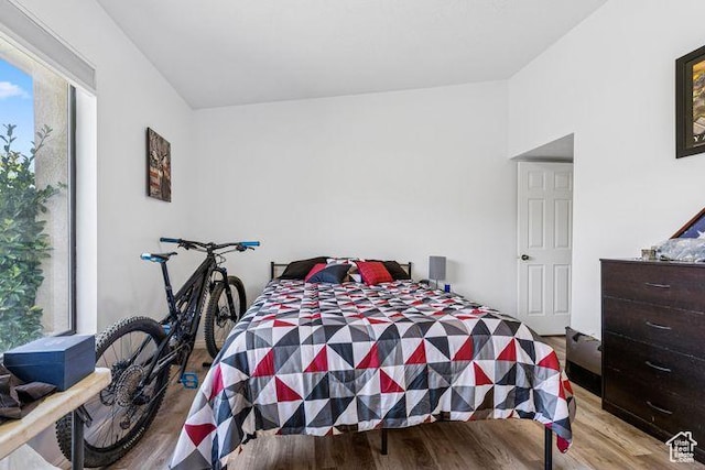 bedroom with wood finished floors