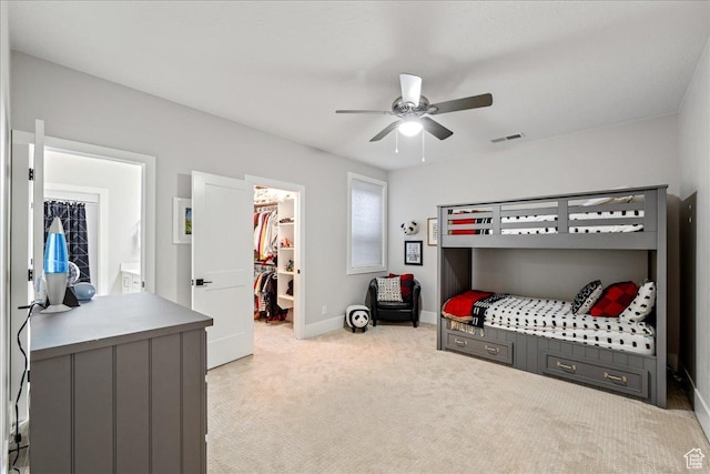 684 S 990 W, Hurricane, UT 84737 - bedroom featuring a walk in closet, light colored carpet, baseboards, a closet, and a ceiling fan