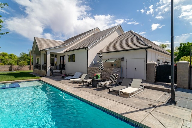 684 S 990 W, Hurricane, UT 84737 - back of property with a patio area, a tile roof, stucco siding, and a gate