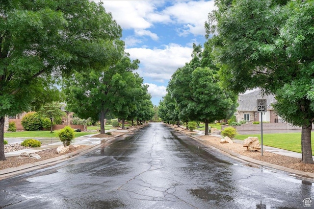 684 S 990 W, Hurricane, UT 84737 - view of asphalt road featuring sidewalks, curbs, and traffic signs