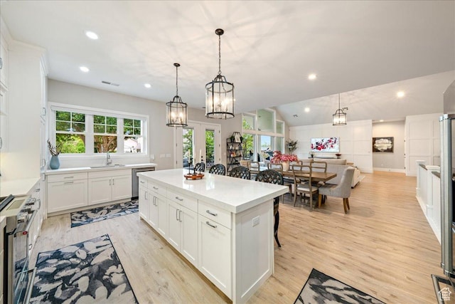 684 S 990 W, Hurricane, UT 84737 - kitchen with appliances with stainless steel finishes, a kitchen island, healthy amount of natural light, white cabinetry, and recessed lighting