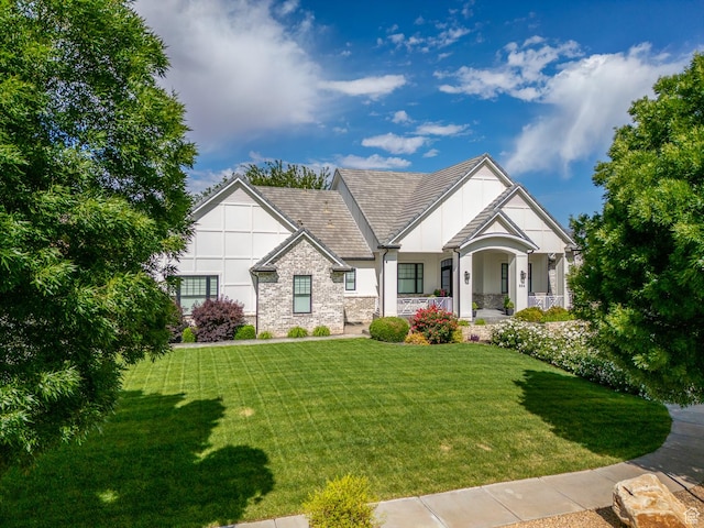 684 S 990 W, Hurricane, UT 84737 - view of front of home featuring a front lawn, stone siding, stucco siding, and a porch