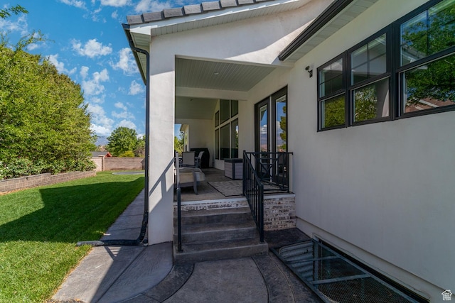 684 S 990 W, Hurricane, UT 84737 - view of exterior entry with stucco siding and a lawn