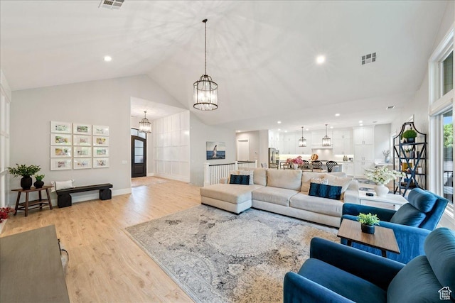 684 S 990 W, Hurricane, UT 84737 - living area with a chandelier, light wood-style floors, high vaulted ceiling, recessed lighting, and baseboards